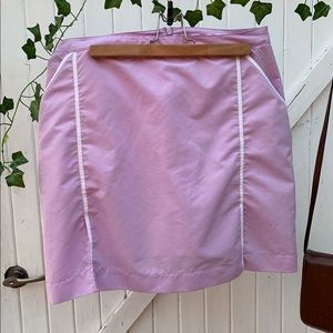 Above the knee, purple skirt